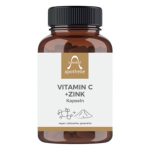 Braune Glasflasche mit Kapseln, etikettiert mit "Vitamin C + Zink", vegan, laktosefrei, glutenfrei.