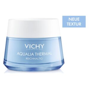Eine hautfeuchtigkeitsspendende Creme in einem blauen Glasbehälter mit einem weißen Deckel und der Aufschrift 'Aqualia Thermal' und 'reichhaltig'.