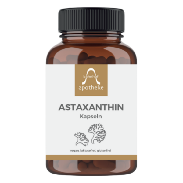 Braune Kapseln in einer transparenten Flasche mit Schraubverschluss, beschriftet mit "ASTAXANTHIN" und Zusatzinformationen zur veganen und glutenfreien Herstellung.